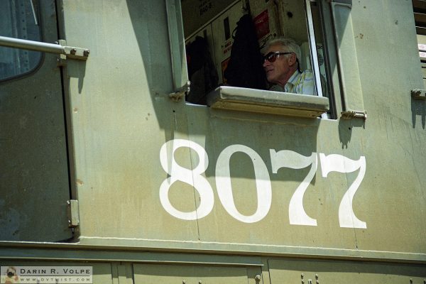 "8077" [Railroad Conductor in a GE B40-8 in San Luis Obispo, California]