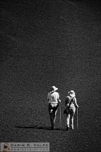 "Moonwalk" [Hikers on Inferno Cone in Craters of the Moon National Monument, Idaho]