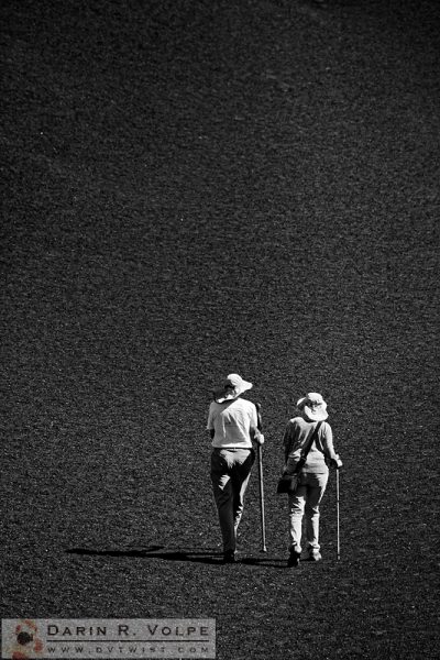 "Moonwalk" [Hikers on Inferno Cone in Craters of the Moon National Monument, Idaho]