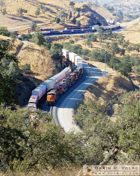 "Trains That Pass in the Day" [Two Freight Trains in the Tehachapi Mountains, California]