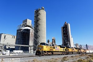 "Building America" [Union Pacific Freight Train and Cement Plant in Monolith, California]