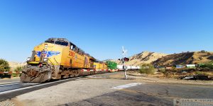 "Sign of the Times" [Union Pacific Freight Train at a Grade Crossing in Caliente, California]