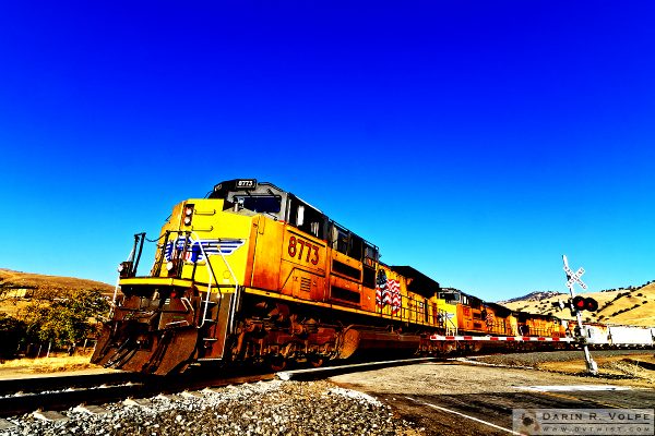 "Bells and Whistles" [Union Pacific Freight Train at Railroad Crossing in Caliente, California]