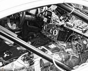 "Bare Necessities" by Darin Volpe [Race Car Cockpit At The 24 Hours Of Lemons Race, Sonoma California]